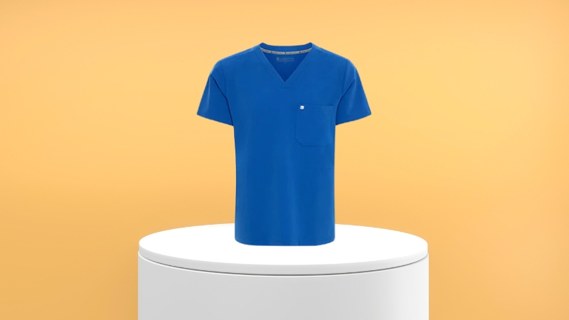Royal blue menโs undershirt displayed on a white podium against a warm gradient background